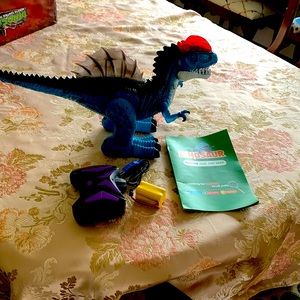 Dinosaur remote control dilophosaurus. New in battered box.